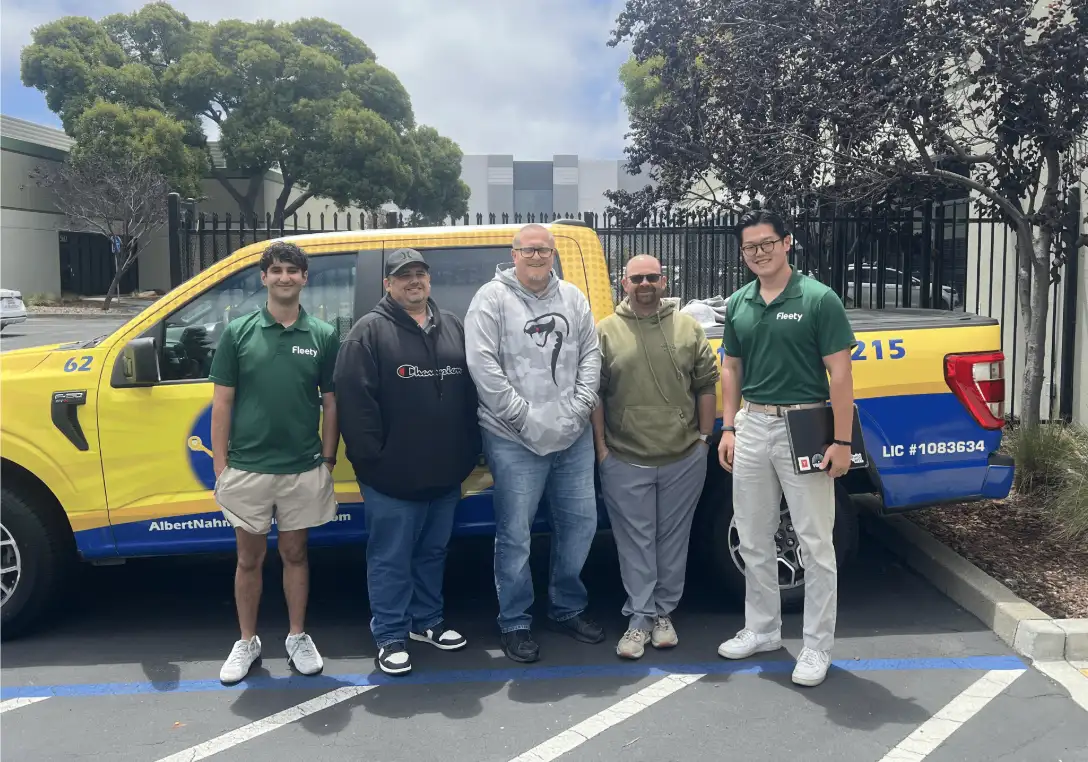 Fleety with the Albert Nahman team beside their service truck